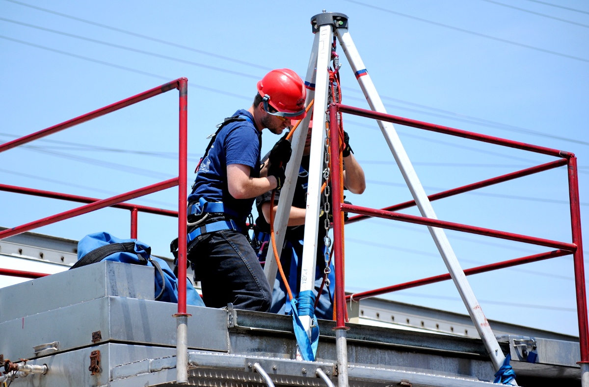 Industrial rescue students performing confined space rescue during training