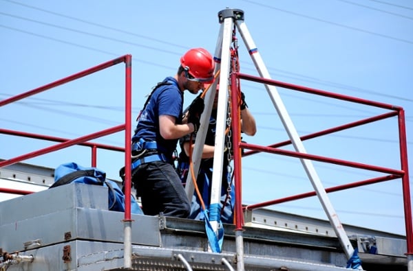 Industrial rescue students performing confined space rescue during training