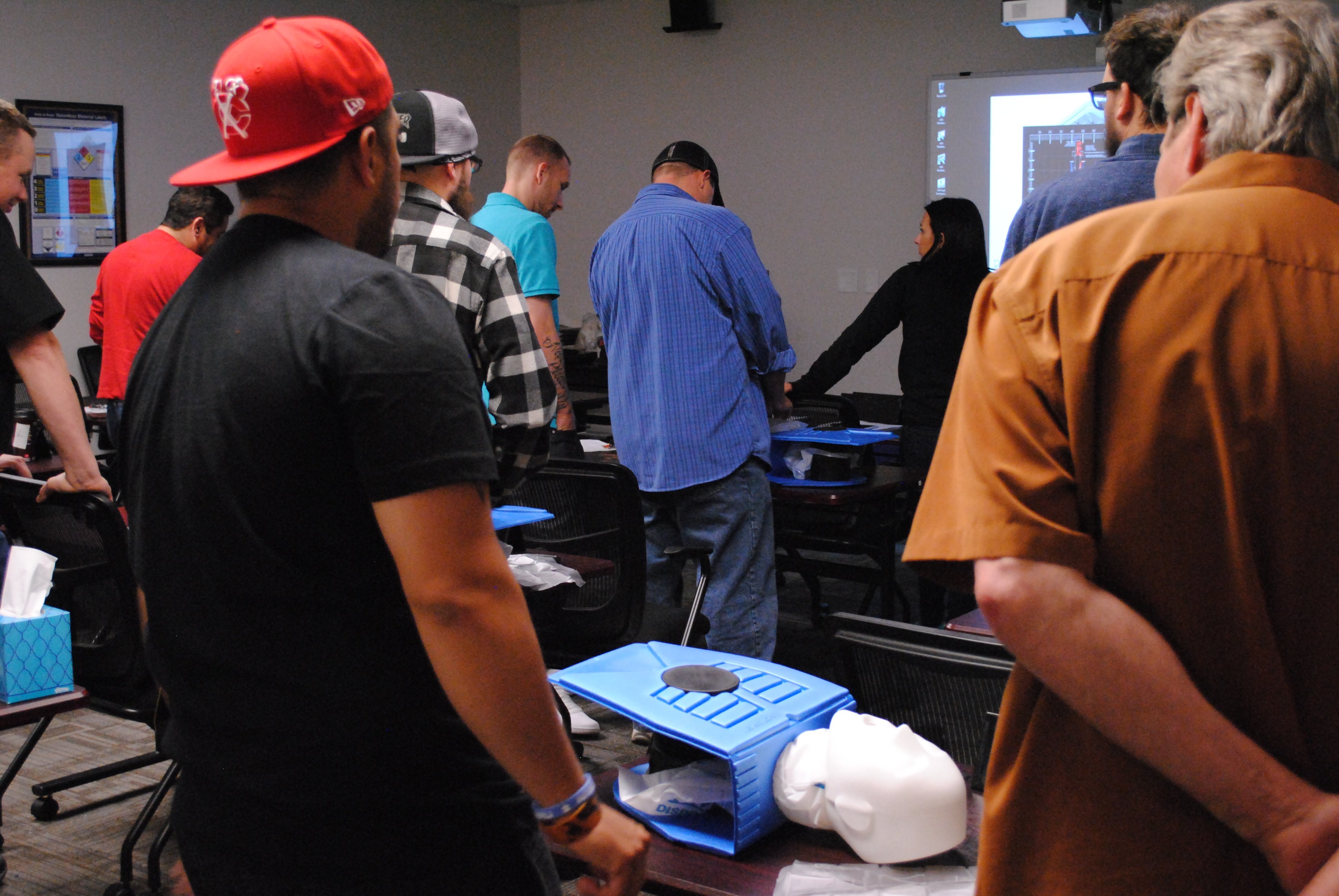 Students performing CPR during first aid training