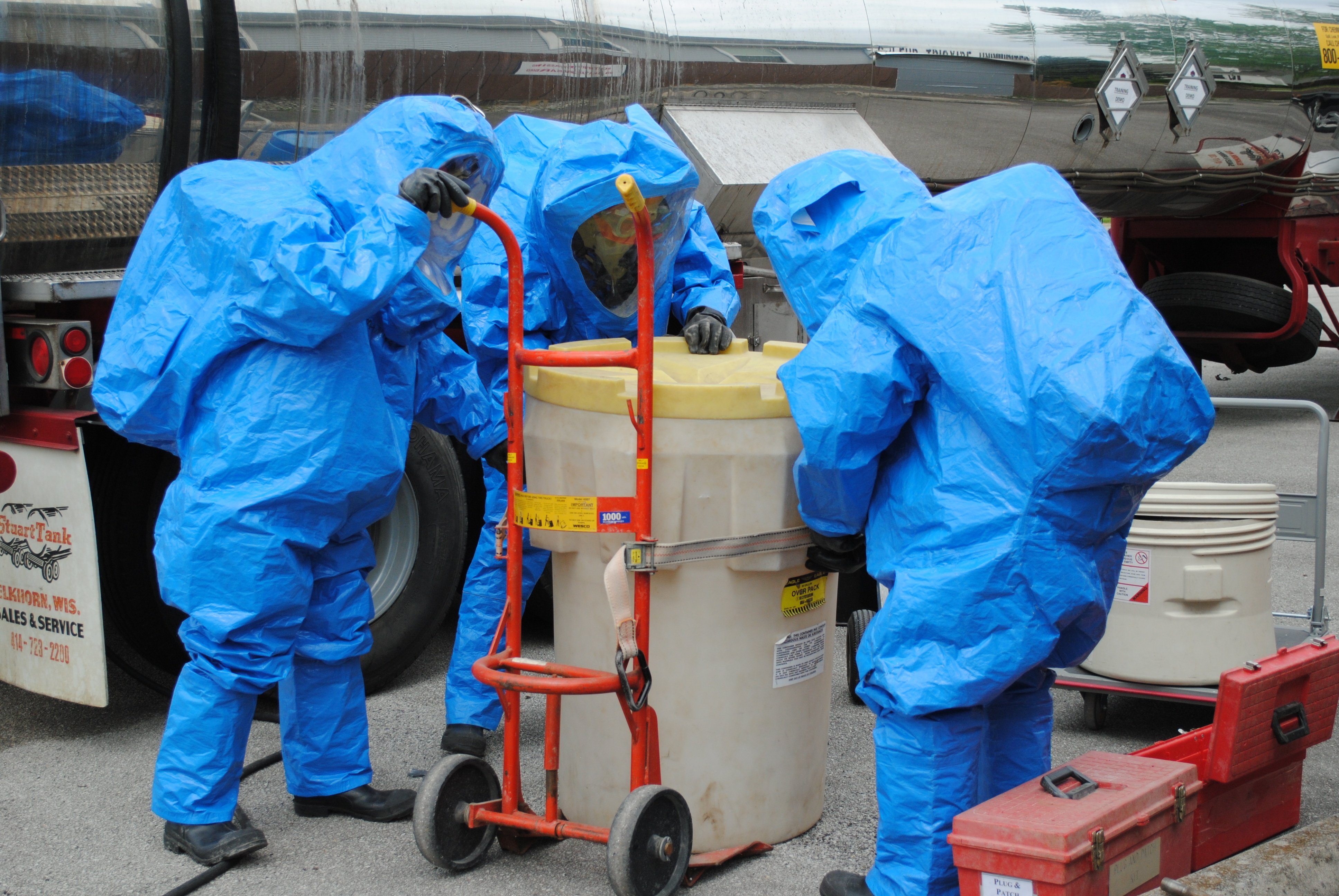 Hazwoper students recover a drum spill during hazmat refresher training