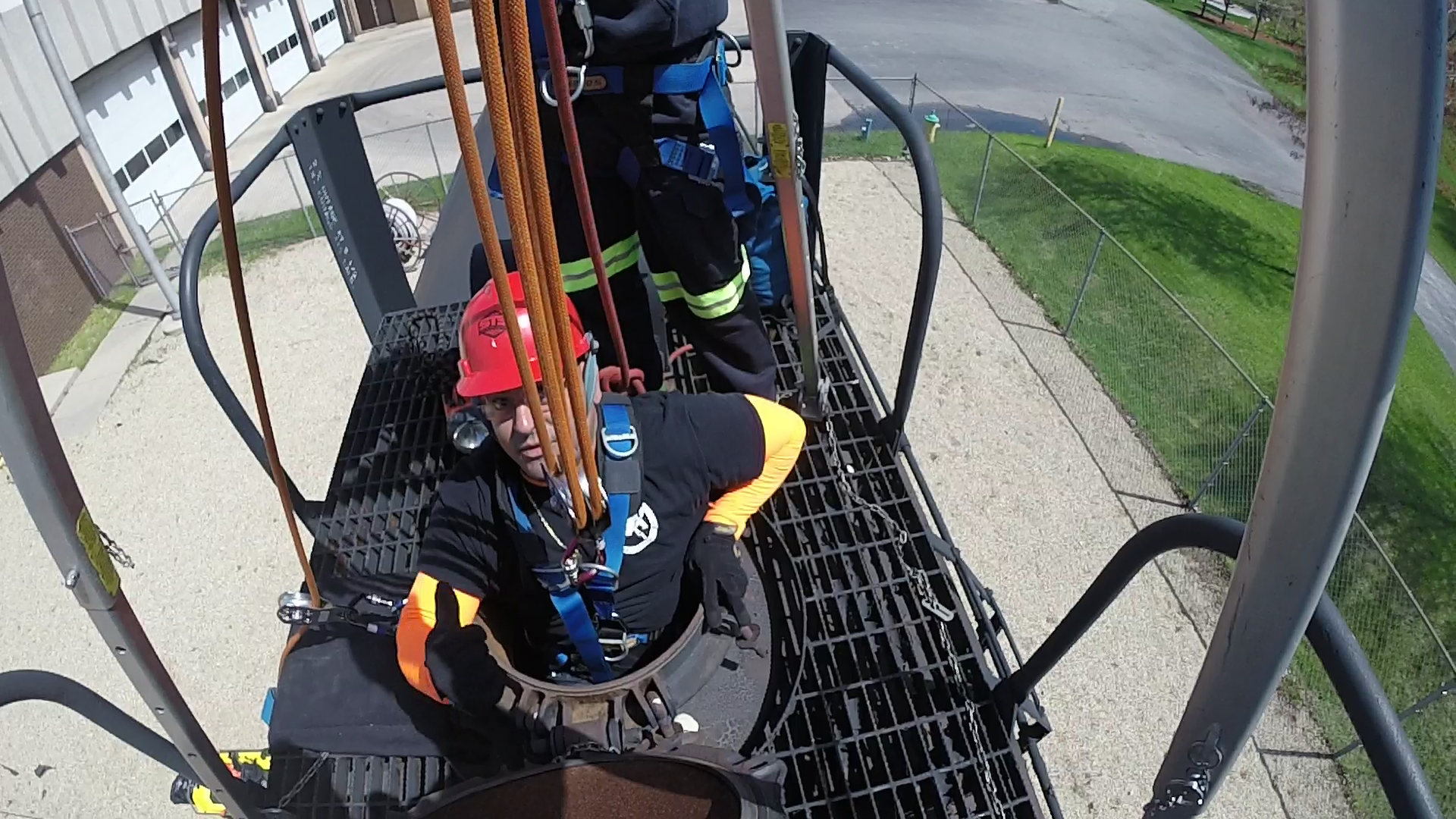 Industrial rescue students emerge from confined space during training